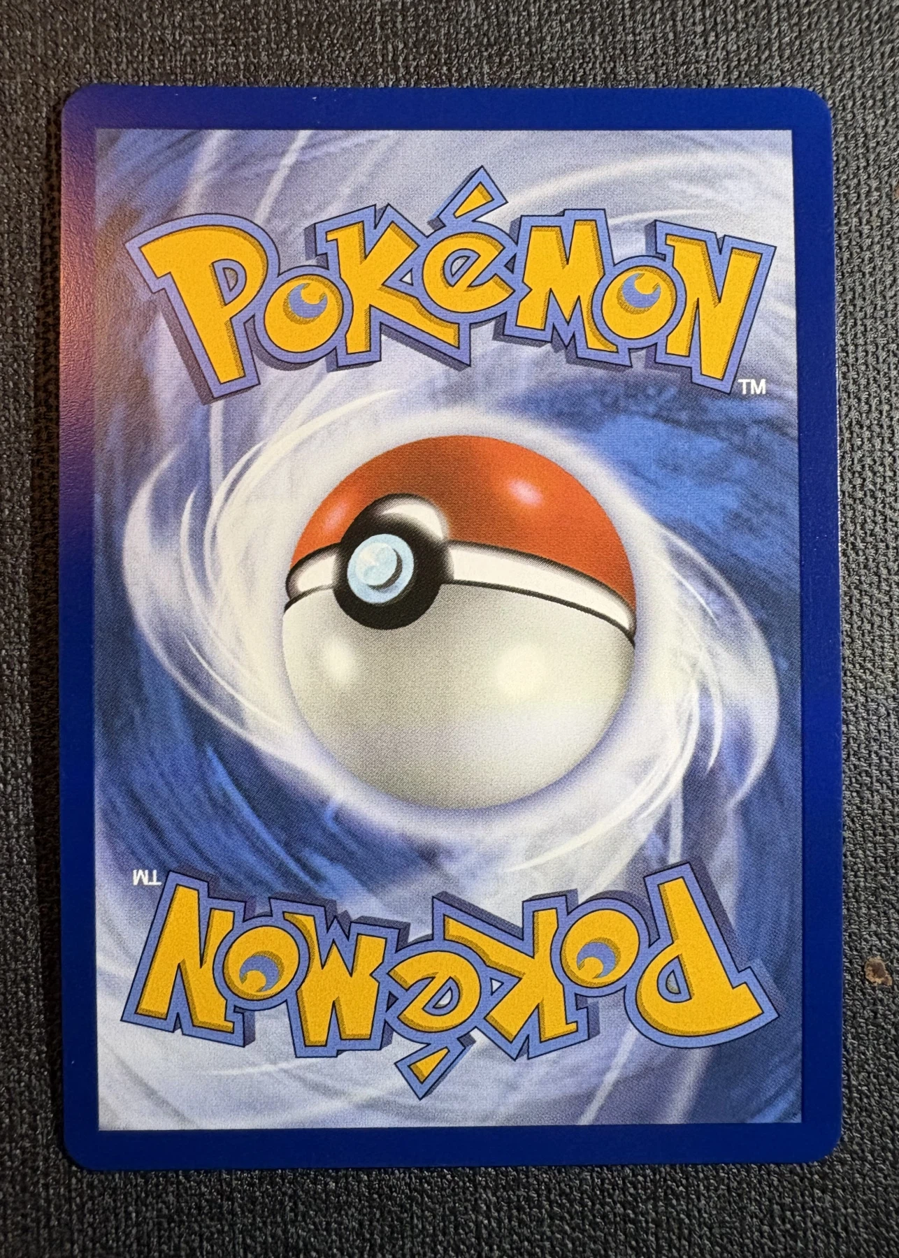 Mega Charizard X ex 125/94 Phantasmal Flames back card photo in GradeValue pregrading report