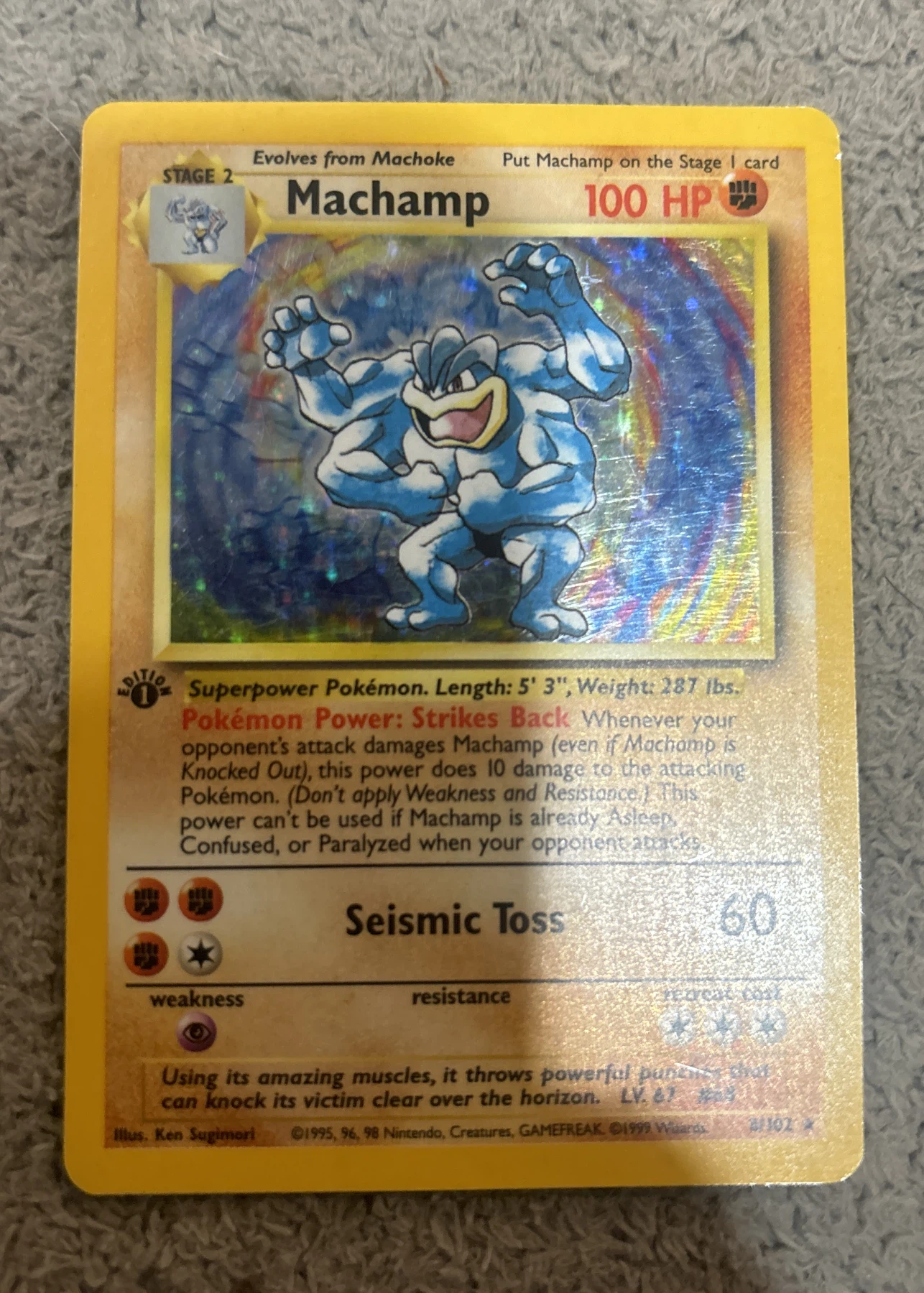 Machamp 008/102 (First Edition Stamp) Base Set front card photo in GradeValue pregrading report