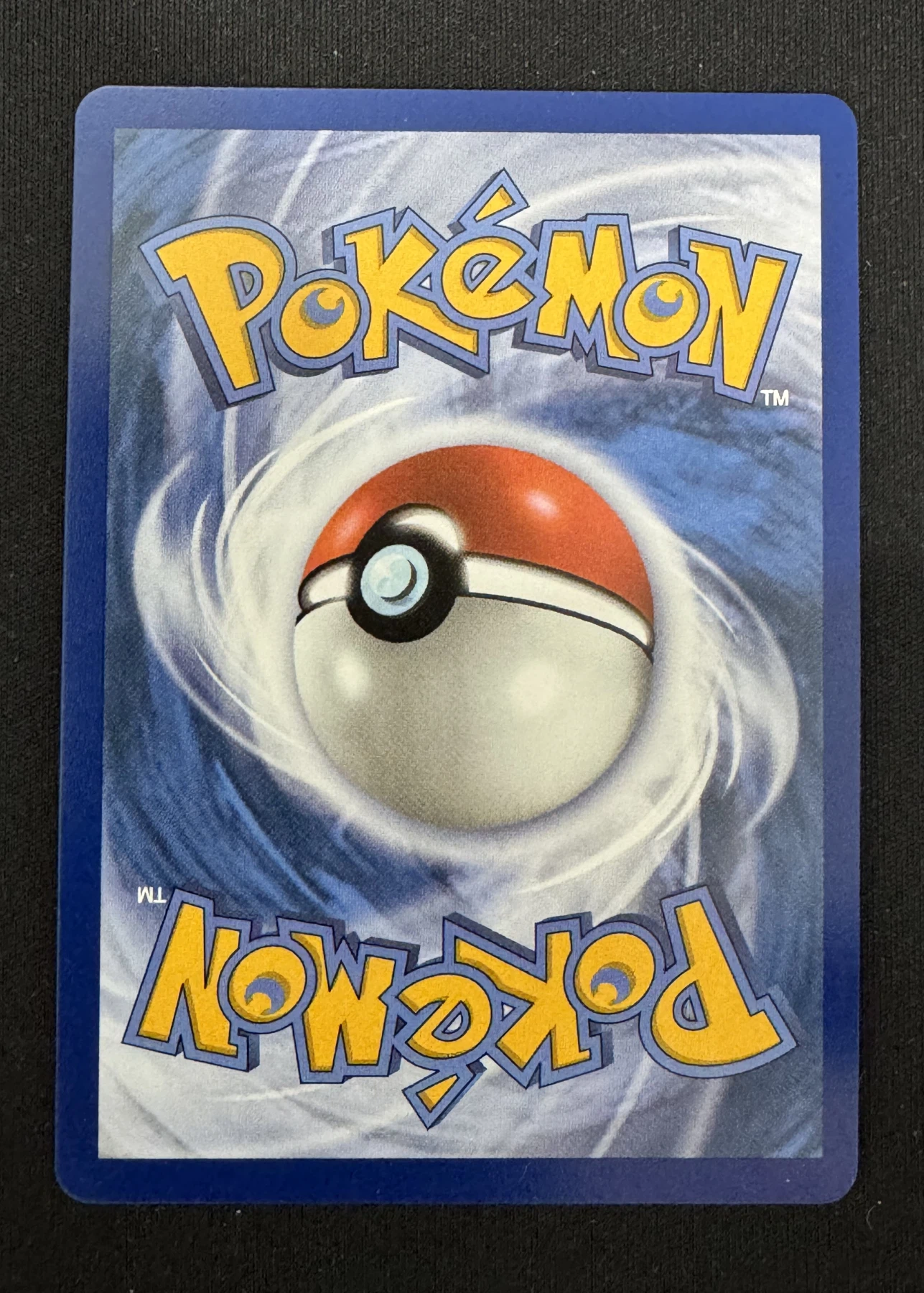 Meowth 106/94 Phantasmal Flames back card photo in GradeValue pregrading report