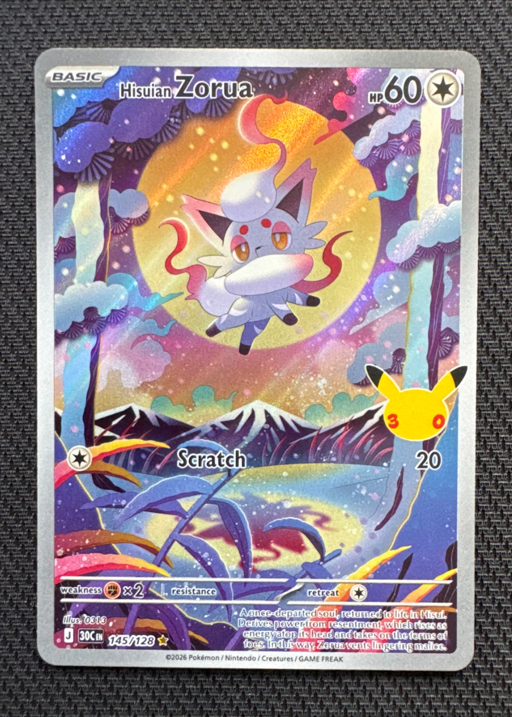 Hisuian Zorua 145/128 30th Celebration front card photo in GradeValue pregrading report