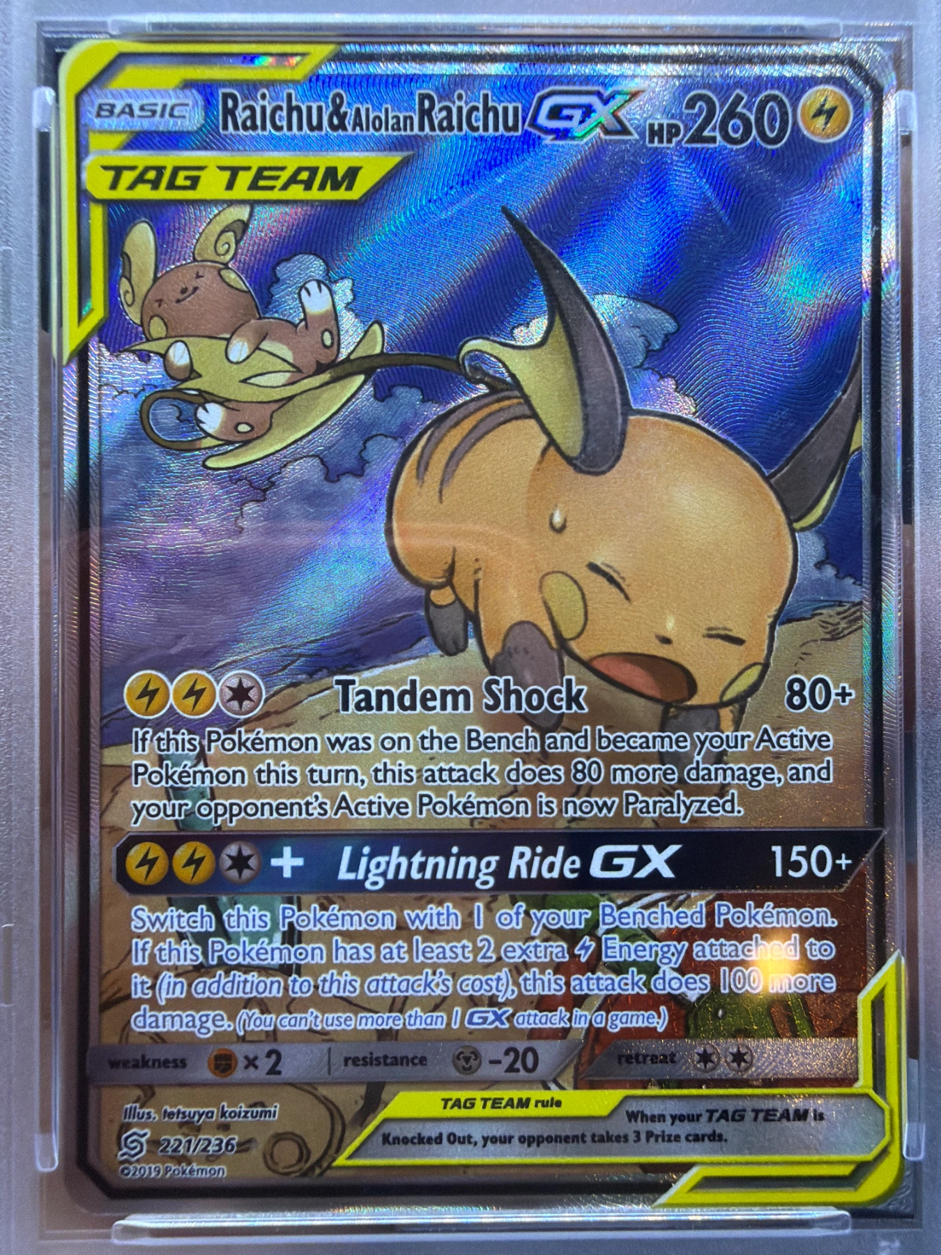 Raichu & Alolan Raichu GX 221/236 Unified Minds front card photo in GradeValue pregrading report