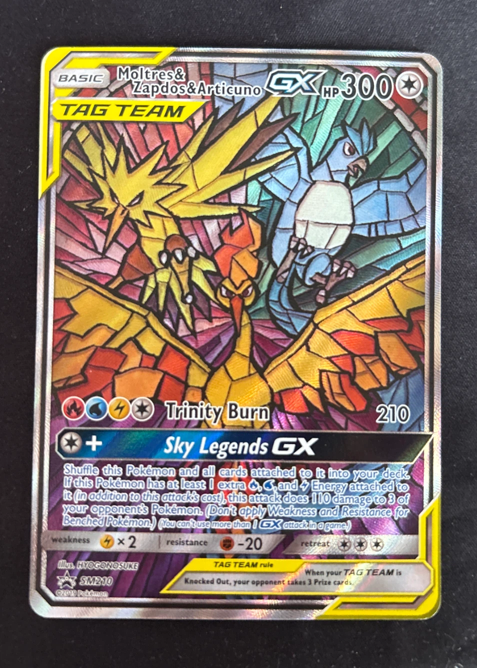 Moltres & Zapdos & Articuno GX SM210/248 SM Black Star Promos front card photo in GradeValue pregrading report