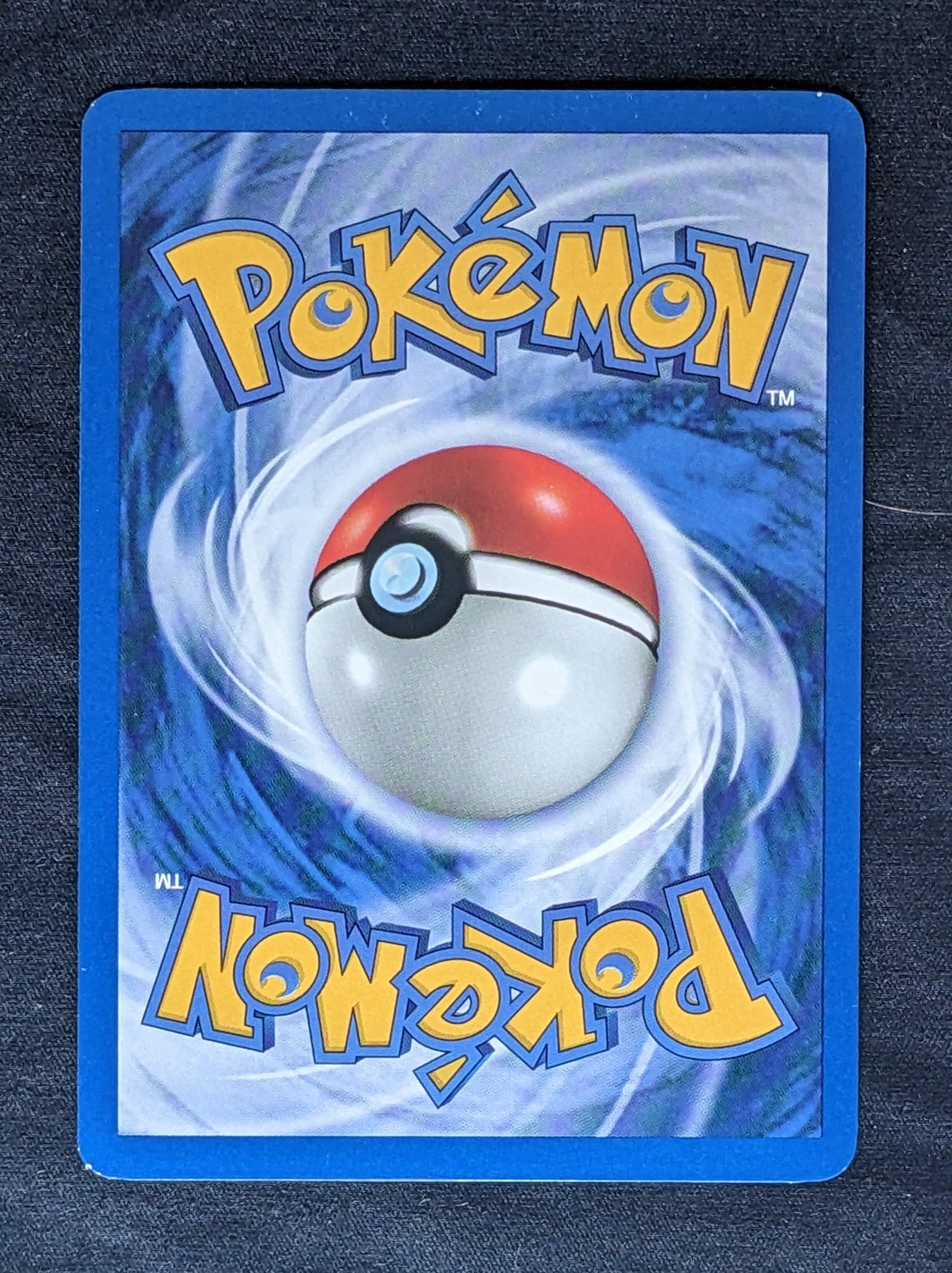 Dark Charizard 004/82 (First Edition Stamp) Team Rocket back card photo in GradeValue pregrading report
