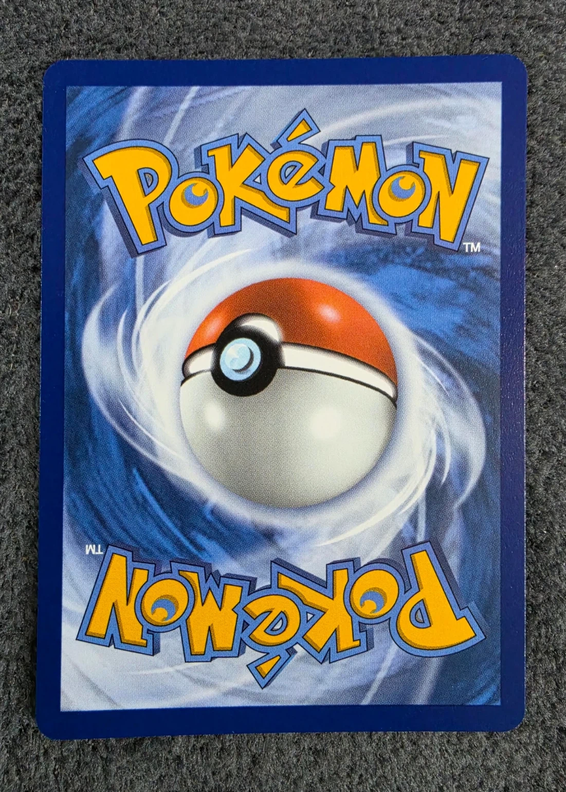 Eevee 116/128 30th Celebration back card photo in GradeValue pregrading report