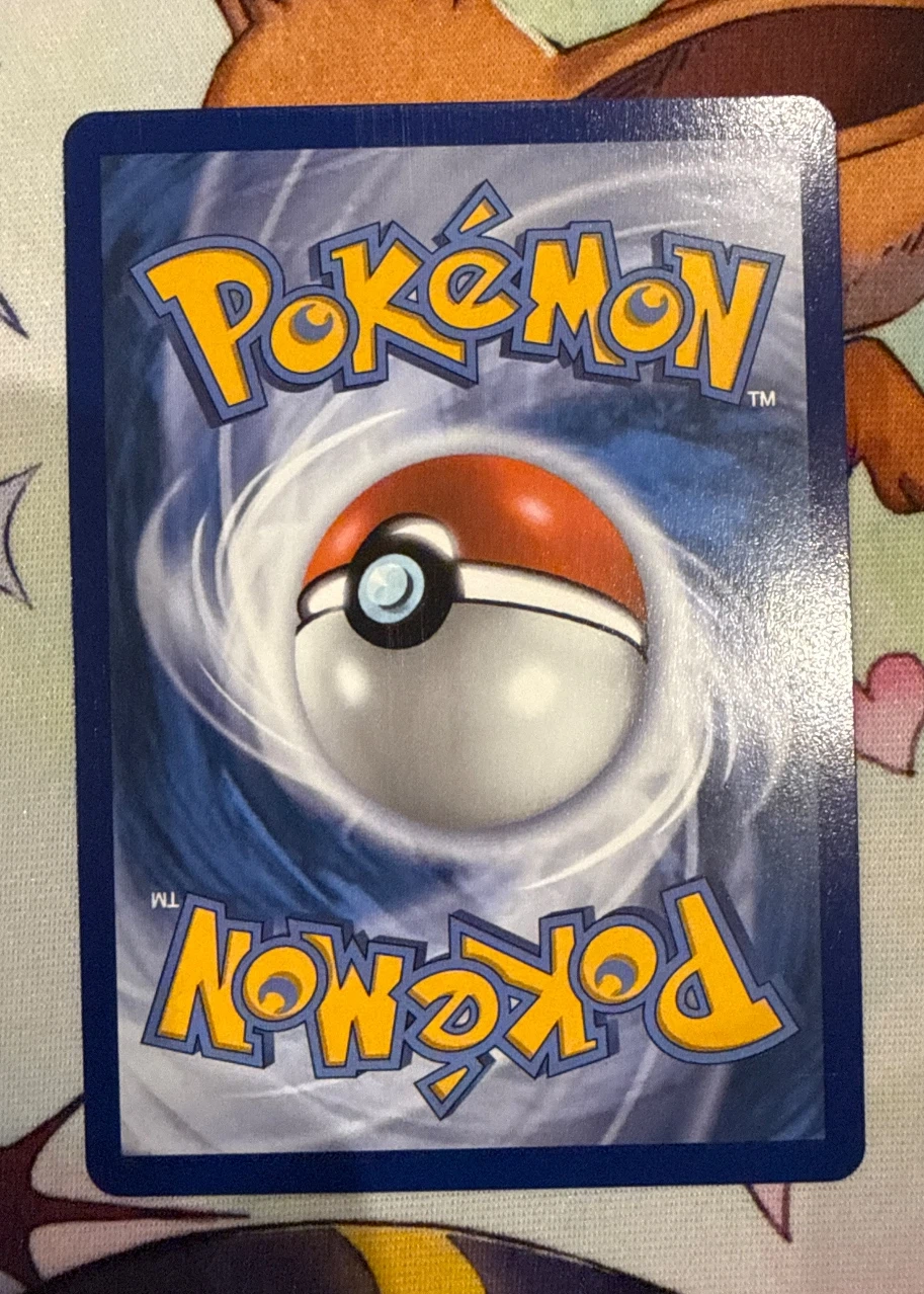 Mega Charizard X ex 125/94 Phantasmal Flames back card photo in GradeValue pregrading report