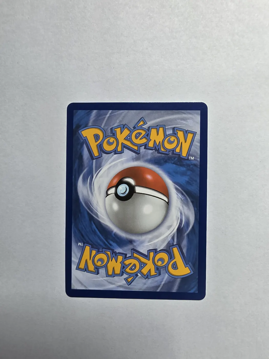 Meowth 106/94 Phantasmal Flames back card photo in GradeValue pregrading report