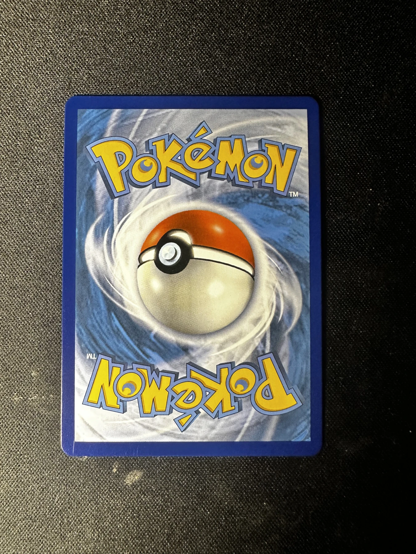 Reshiram & Charizard GX 020/214 Unbroken Bonds back card photo in GradeValue pregrading report