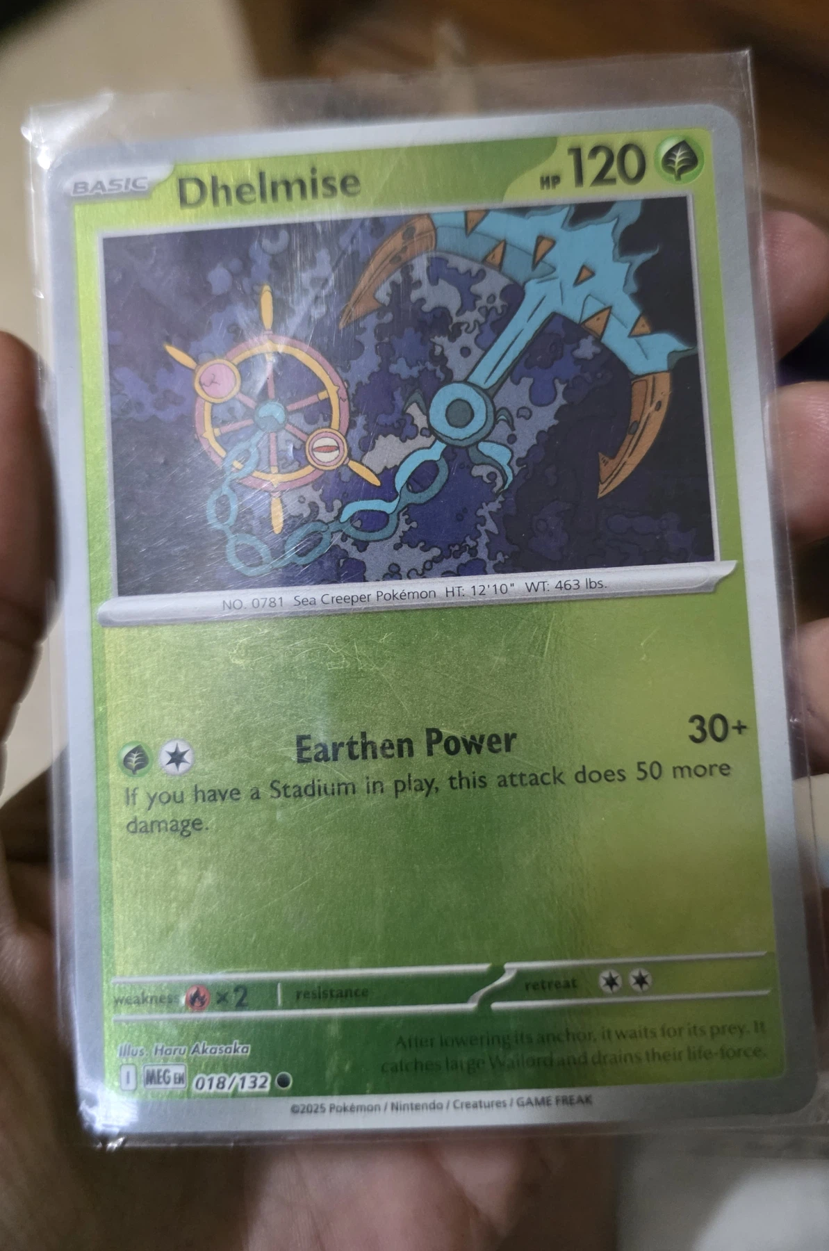 Dhelmise 018/132 Mega Evolution front card photo in GradeValue pregrading report