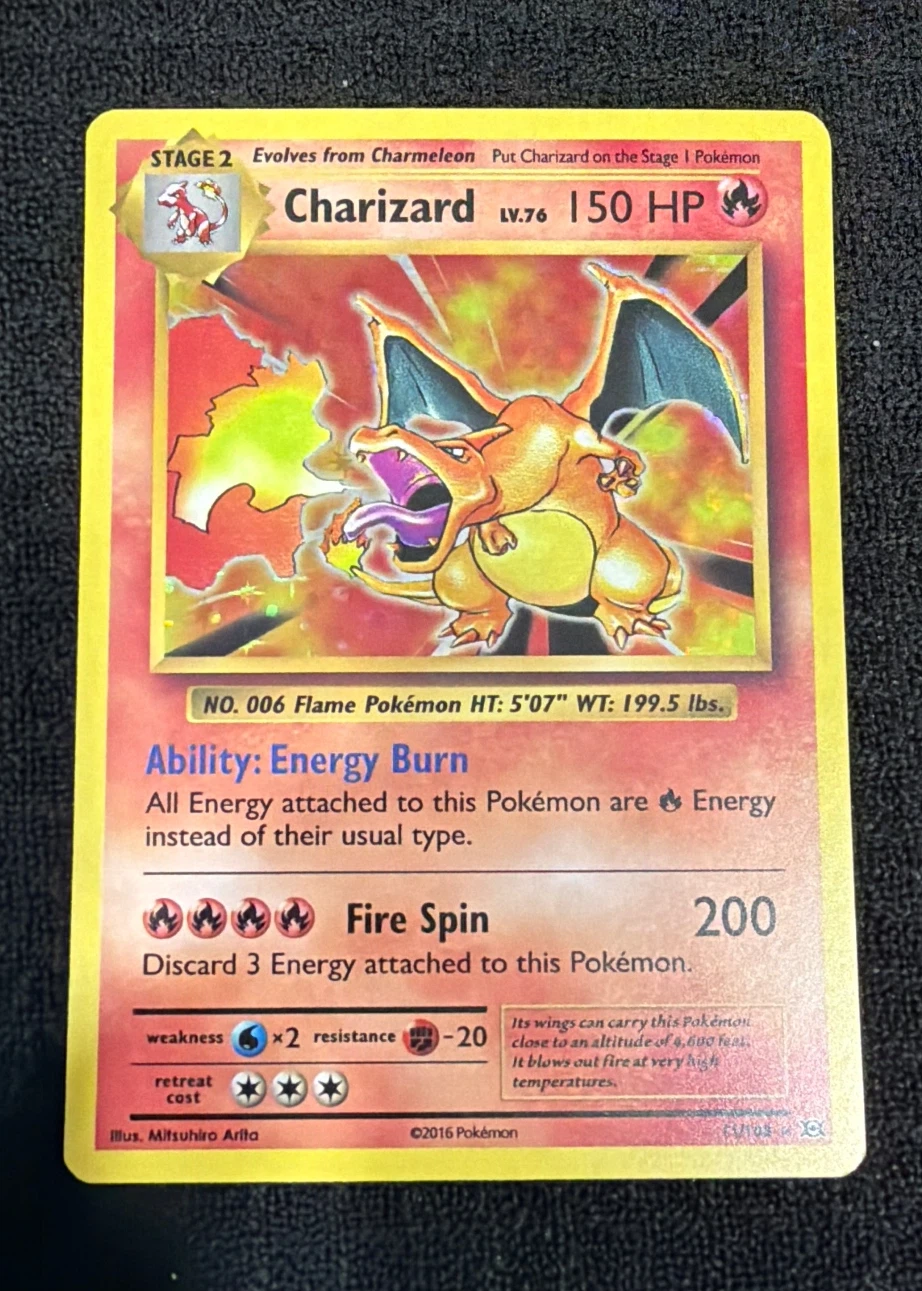 Charizard 011/108 Evolutions front card photo in GradeValue pregrading report